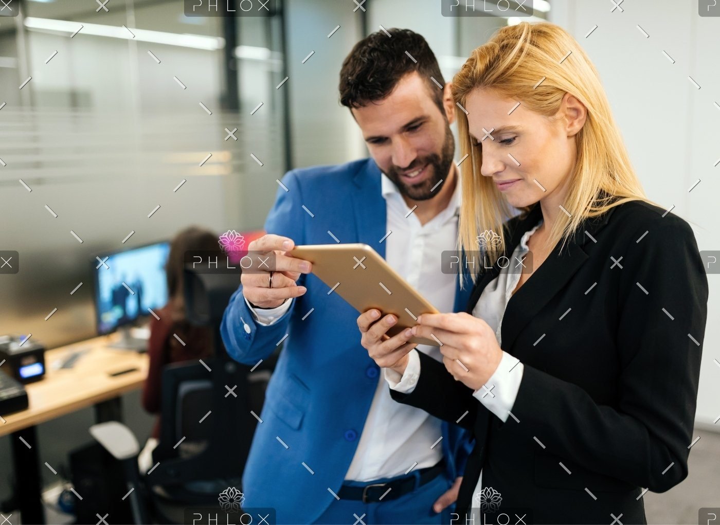 demo-attachment-143-businesspeople-discussing-while-using-digital-WFGVC3X